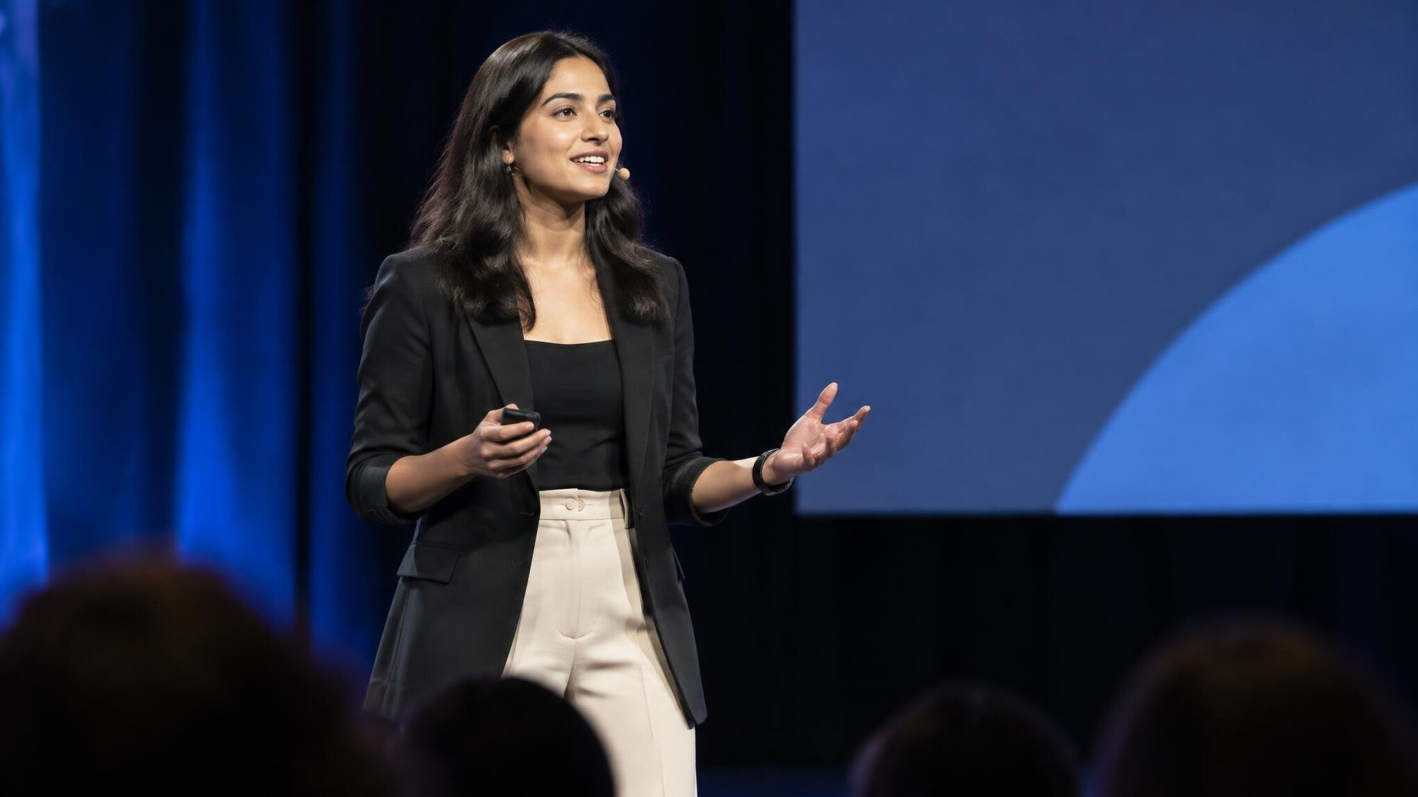 person giving speech on stage